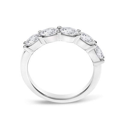 White metal ring with five oval-shaped white gemstones in a shared prong setting, shown in a close-up side angle.