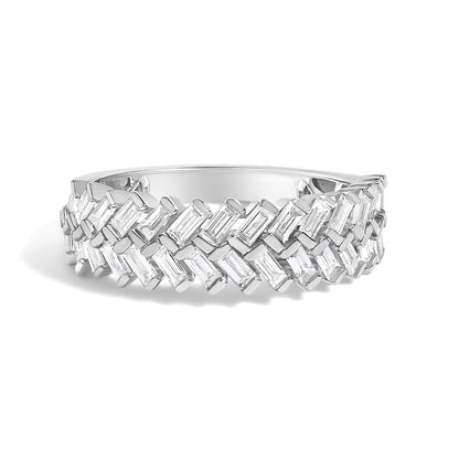 Close-up front angle of a white metal ring featuring two rows of channel-set baguette-shaped white gemstones arranged in a diagonal pattern.