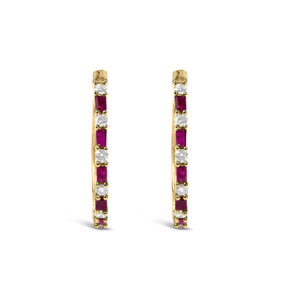 Close-up front view of a pair of yellow metal hoop earrings set with alternating round white gemstones and rectangular red gemstones in prong settings.