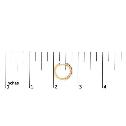 Close-up front view of a yellow metal hoop earring shown on a scale, featuring alternating red baguette-shaped gemstones and white round-shaped gemstones in prong settings along part of the hoop.