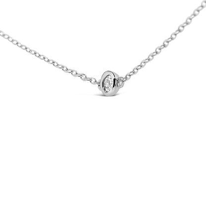 Close-up front angle of a white necklace chain featuring a round bezel-set white gemstone pendant.