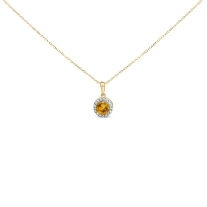 Close-up front view of a yellow metal necklace with a round yellow gemstone pendant surrounded by round white gemstones, shown on a white background.
