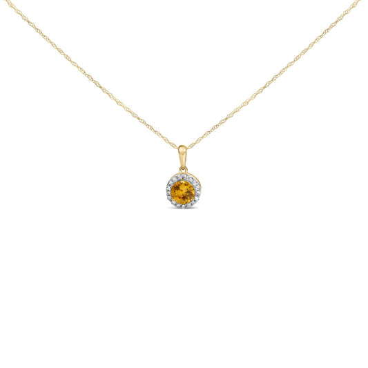 Close-up front view of a yellow metal necklace with a round yellow gemstone pendant surrounded by round white gemstones, shown on a white background.