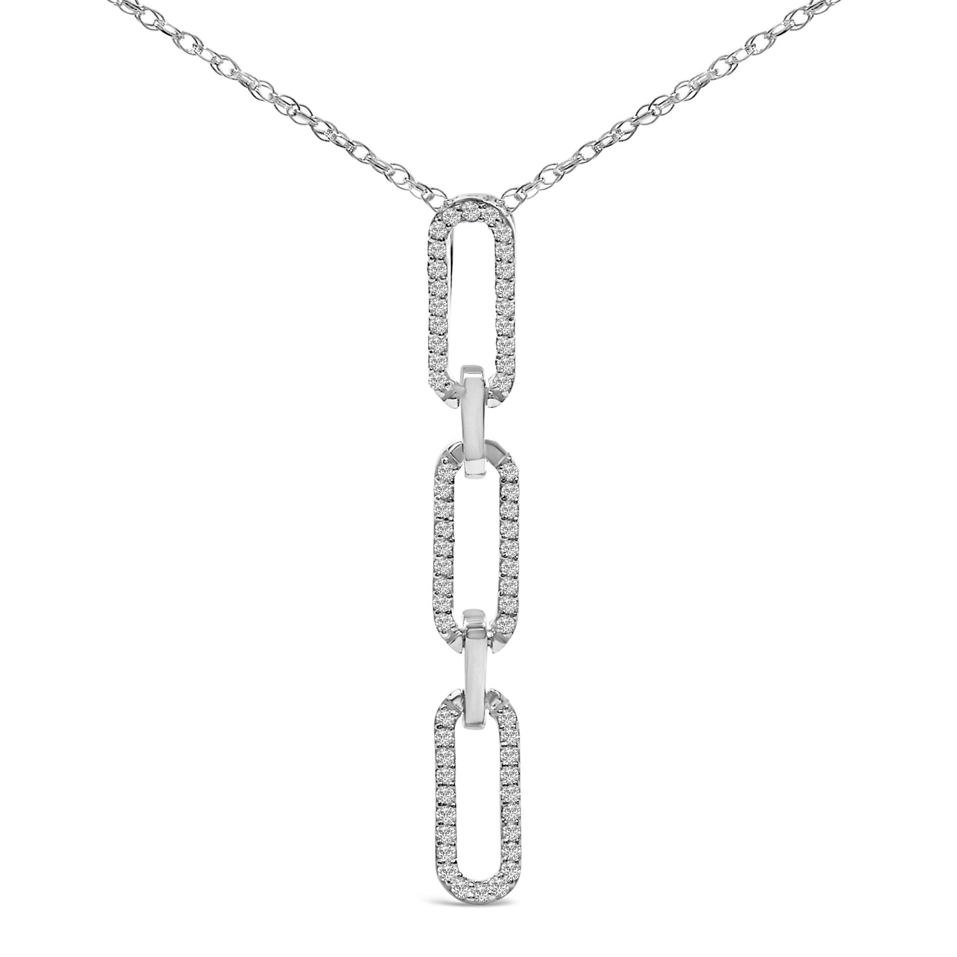 Close-up front view of a white metal necklace with a chain and three elongated rectangular links, each outlined with small round white gemstones in prong settings.