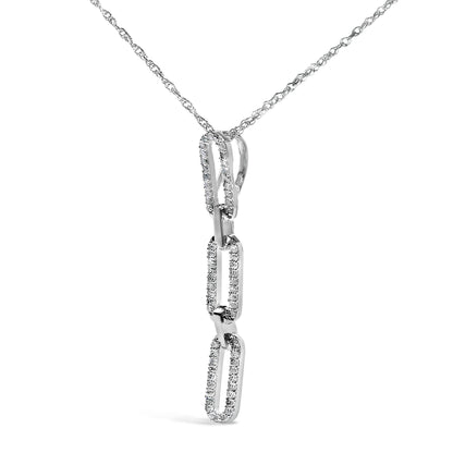 Close-up front angle of a white metal necklace with a pendant consisting of three elongated rectangular links, each adorned with white round gemstones in prong settings.