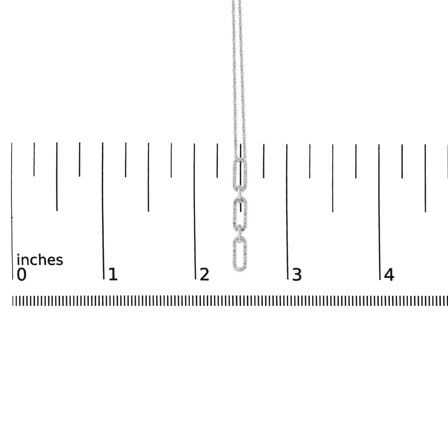 White metal necklace with three elongated oval links encrusted with small round white gemstones in a prong setting, shown hanging vertically on a scale with inch markings, front-facing angle.