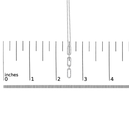 White metal necklace with three elongated oval links encrusted with small round white gemstones in a prong setting, shown hanging vertically on a scale with inch markings, front-facing angle.