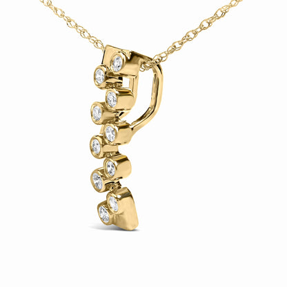 Close-up angled view of a yellow metal necklace pendant with a vertical row of round white gemstones in bezel settings.