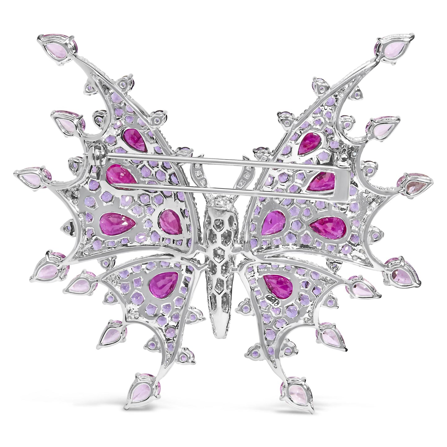 Back view of a white butterfly-shaped brooch with red pear-shaped gemstones, pink pear-shaped gemstones, purple round gemstones, and white round gemstones in pave setting, shown flat on a white background.