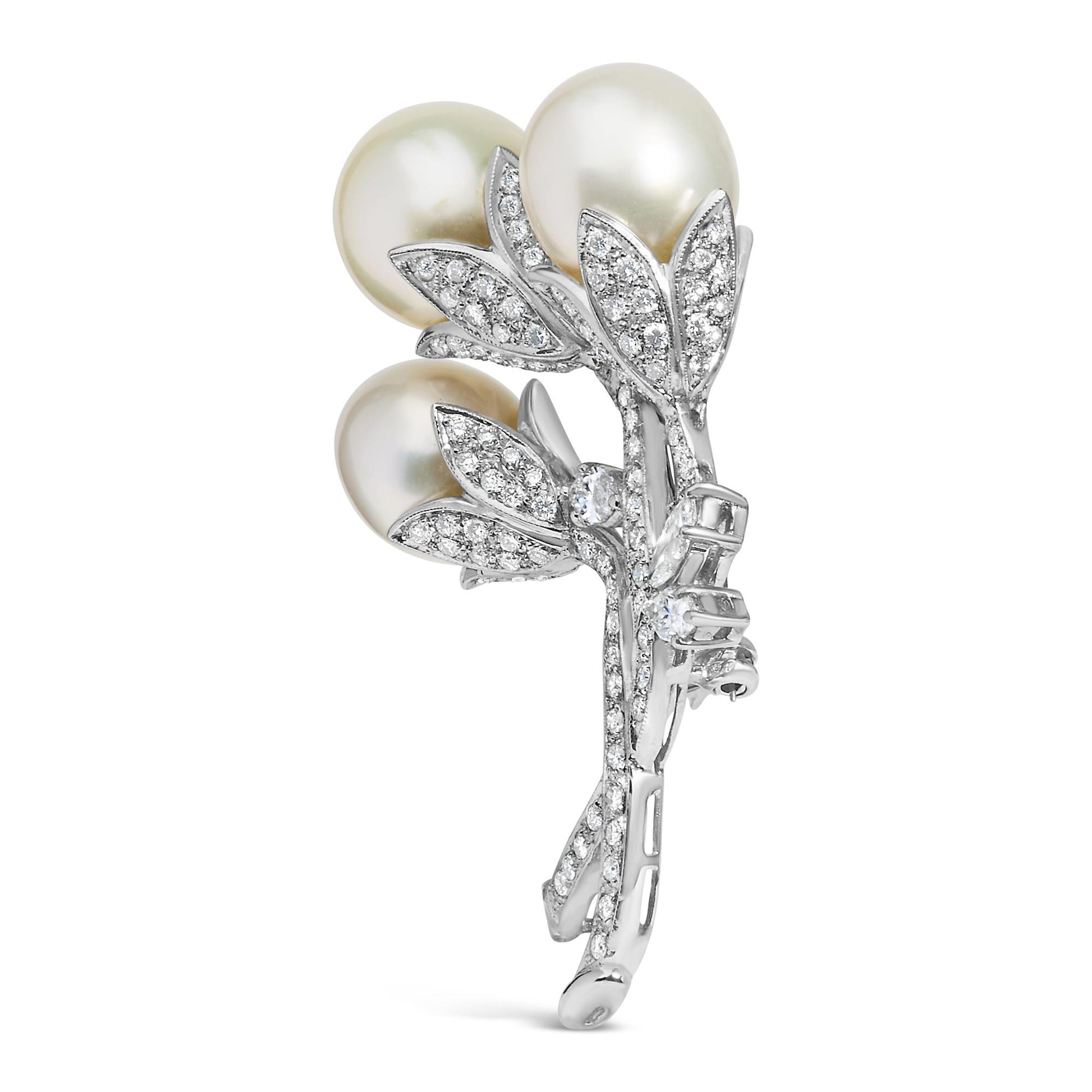 White metal brooch shaped like a floral bouquet with three round white gemstones and multiple small white gemstones in pave setting, shown from a slightly angled front view.