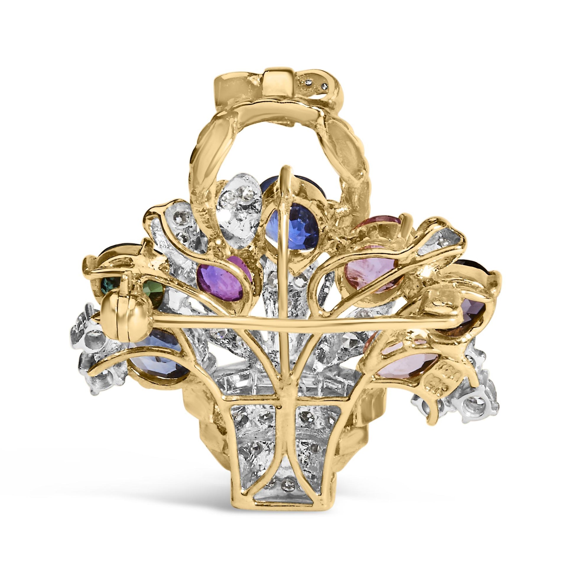 Back view of a yellow metal brooch with blue and purple gemstones and white gemstones in baguette and round shapes, shown against a white background.