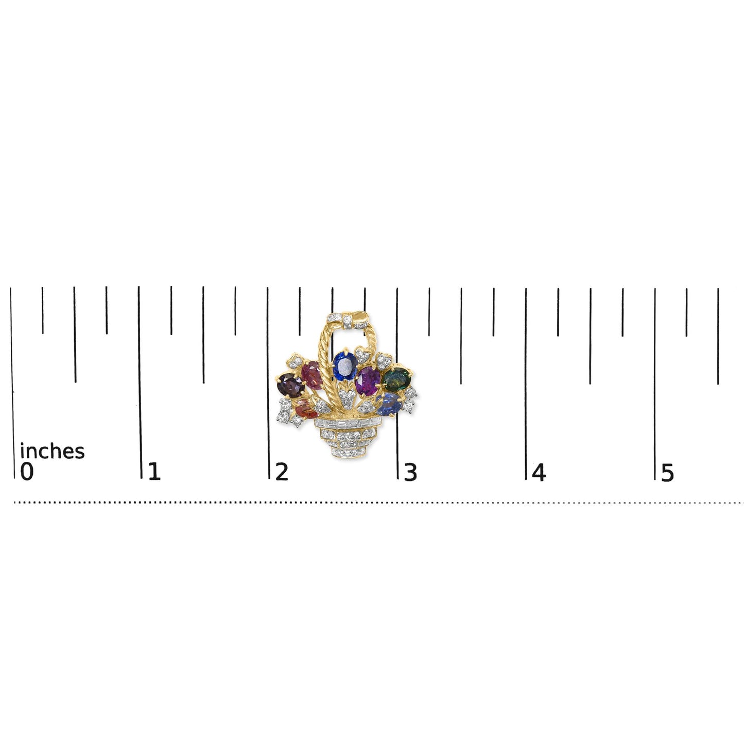 Close-up front view of a yellow metal basket-shaped brooch with round white gemstones, baguette white gemstones in channel setting, a blue oval gemstone, and a purple pear-shaped gemstone, displayed on a ruler for size reference.