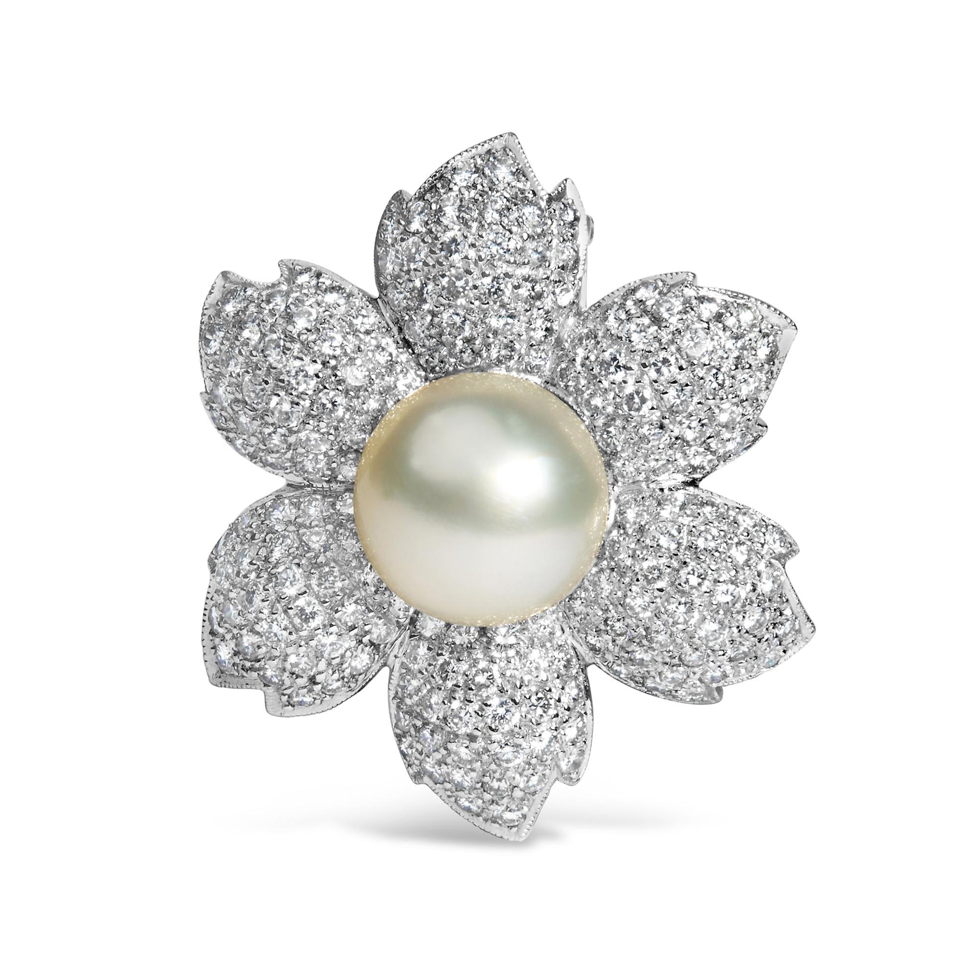 Brooch in flower shape with white metal petals pave set with round white gemstones and a central large white gemstone, front-facing angle.