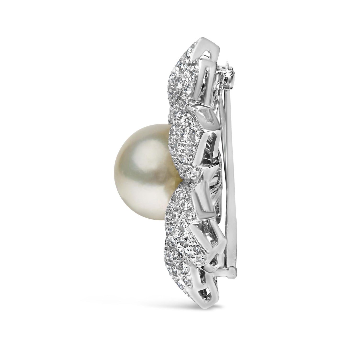 Side view of a white metal brooch with a large round pearl center and surrounding pave-set white round gemstones.