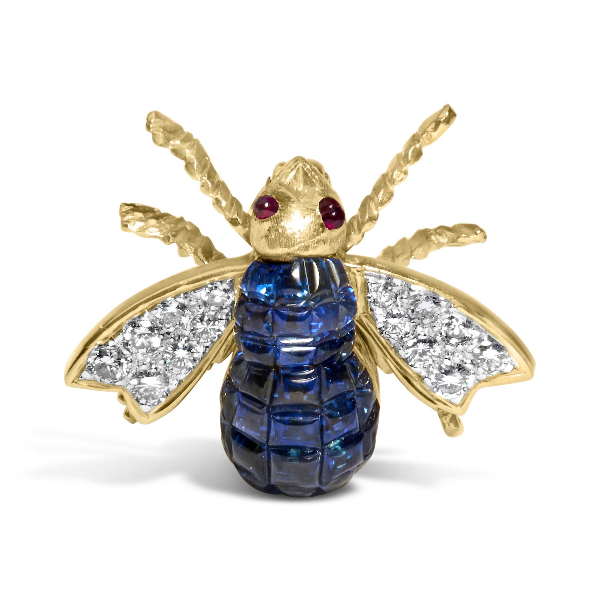 Front angle view of a yellow metal bee-shaped brooch with red gemstones as eyes, blue gemstones on the body, and white gemstones on the wings.