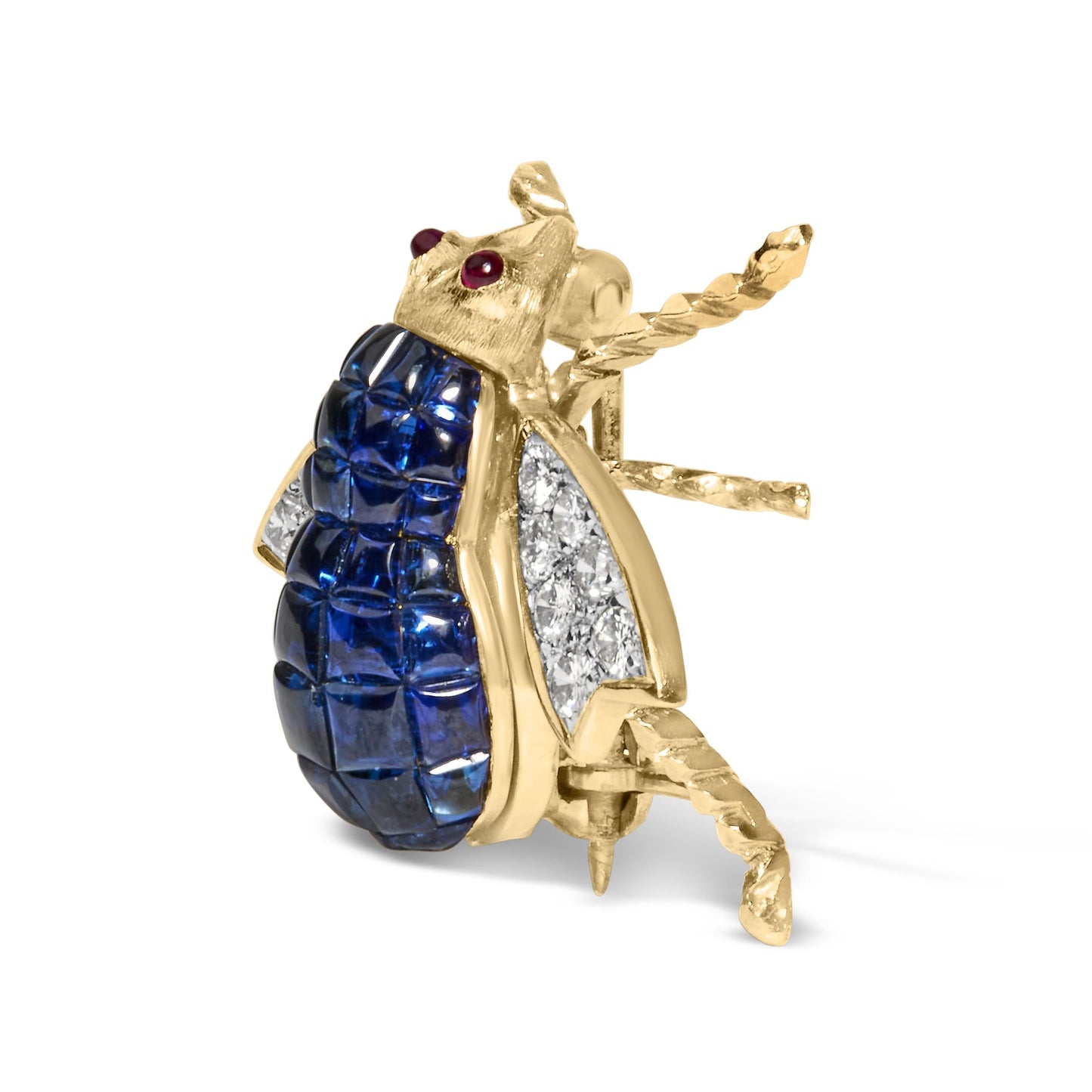 Yellow metal insect-shaped brooch with blue cushion-shaped gemstones on the body, white round pave-set gemstones on the wings, and two red round bezel-set gemstones as eyes, shown in a side angled view.