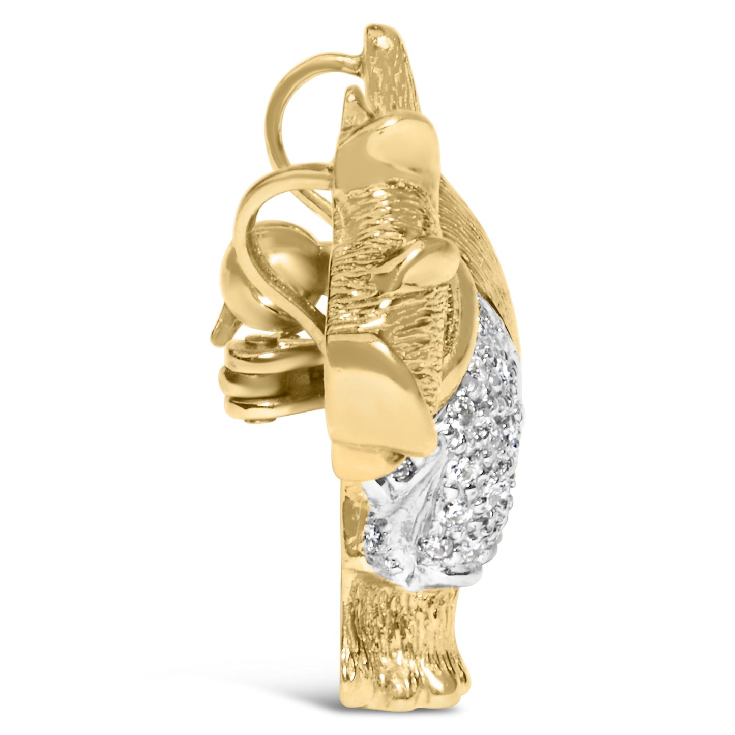 Side view of a yellow metal brooch with a textured design and a cluster of white round pave-set gemstones.