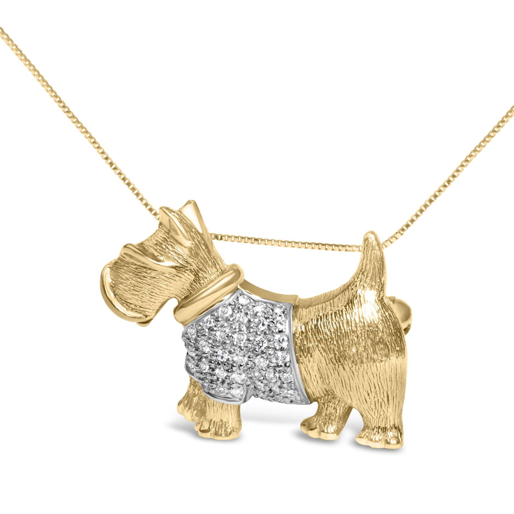 Close-up front angle of a yellow metal dog-shaped brooch with a textured finish and a section adorned with round white gemstones in a pave setting, attached to a chain.