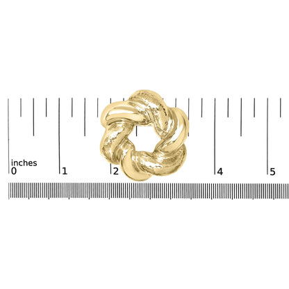 Yellow metal brooch with intertwined twisted loops and textured detail, shown from a top-down view on a scale.