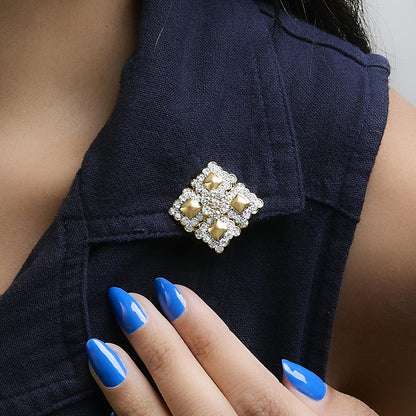 Image shows a yellow metal earring with round white gemstones in prong settings, arranged in a square pattern. The earring is shown worn on a model, with a close-up side angle.