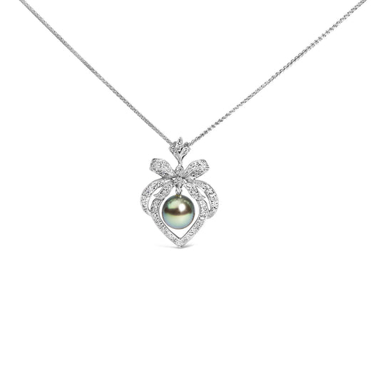 Front-facing view of a white metal necklace with a pendant featuring a bow shape adorned with white round pave-set gemstones and a central dark-colored round gemstone.