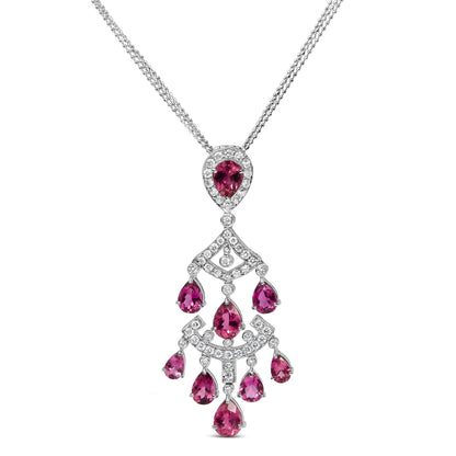 White metal necklace with a pendant featuring pear-shaped pink gemstones and round white gemstones in prong settings, shown from the front.