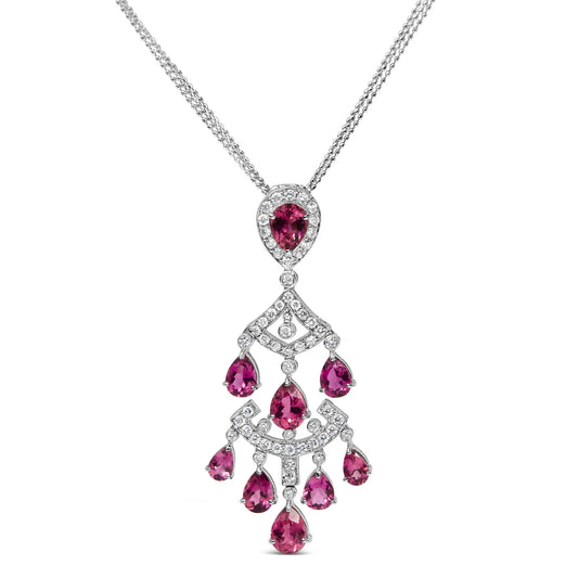 White metal necklace with a pendant featuring pear-shaped pink gemstones and round white gemstones in prong settings, shown from the front.