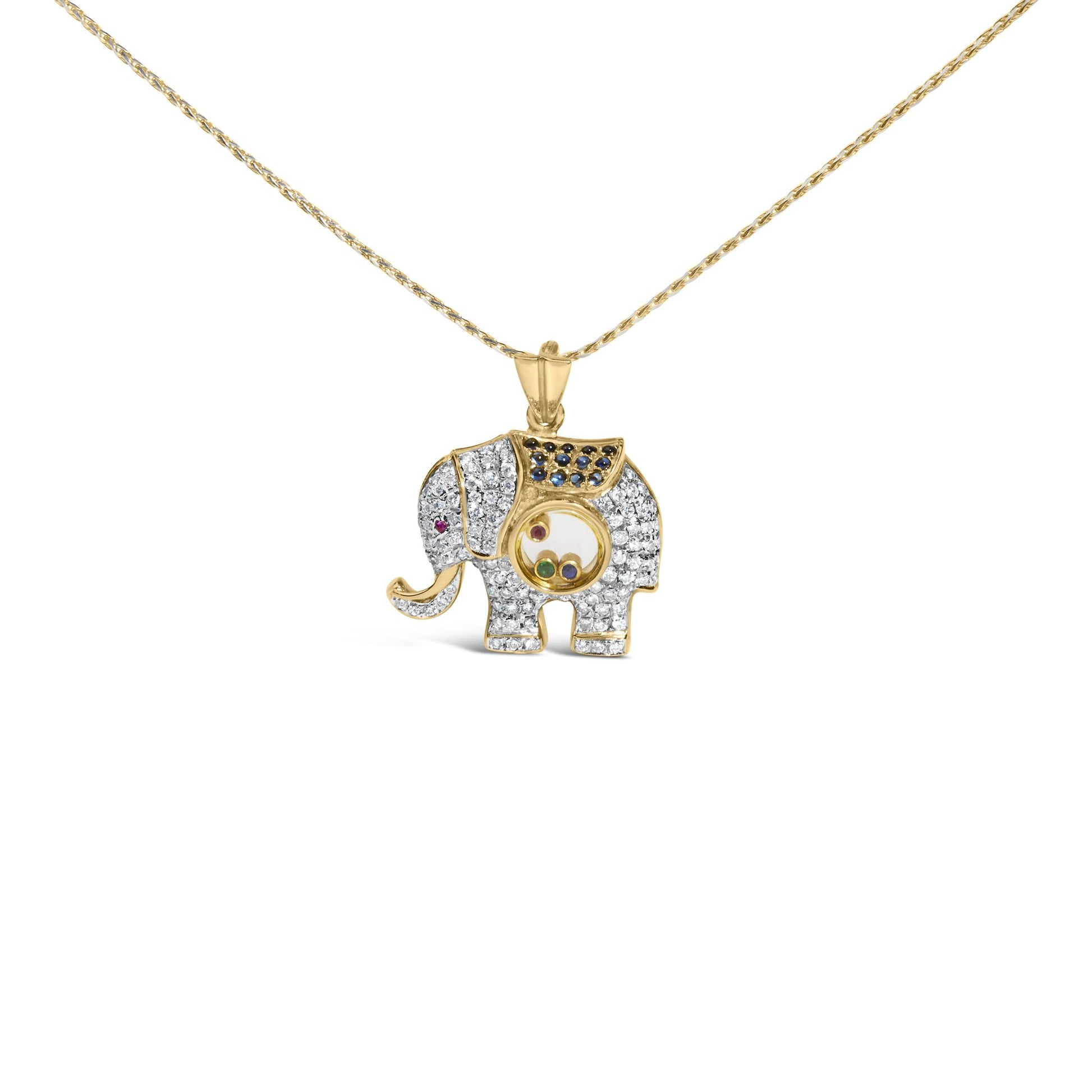 Front view of yellow metal elephant-shaped necklace pendant with white pave-set gemstones covering the body, blue pave-set gemstones on the back, and small bezel-set red and green gemstones inside a circular compartment in the center, shown against a white background.