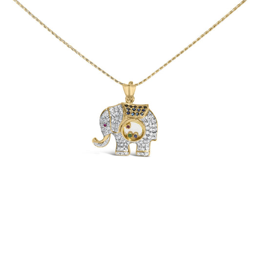 Front view of yellow metal elephant-shaped necklace pendant with white pave-set gemstones covering the body, blue pave-set gemstones on the back, and small bezel-set red and green gemstones inside a circular compartment in the center, shown against a white background.