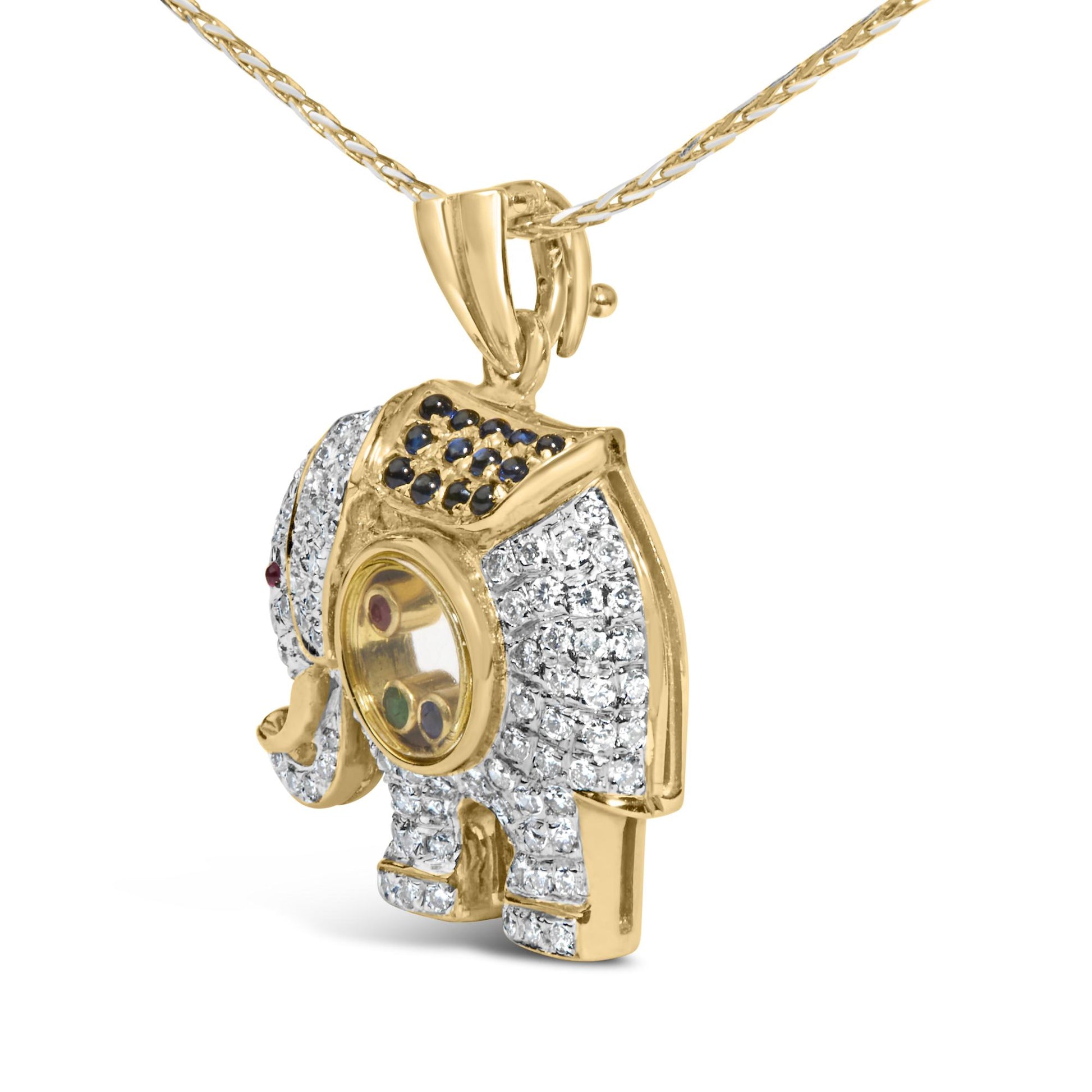 Yellow metal elephant-shaped necklace pendant with white and blue gemstones in pave setting and red and green gemstones in bezel setting, shown in angled close-up.