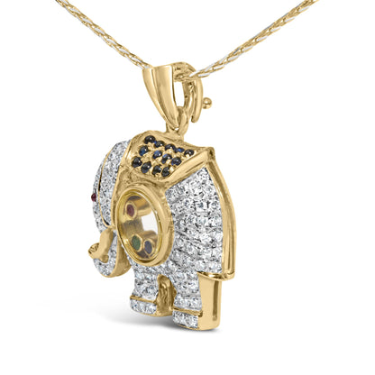 Yellow metal elephant-shaped necklace pendant with white and blue gemstones in pave setting and red and green gemstones in bezel setting, shown in angled close-up.