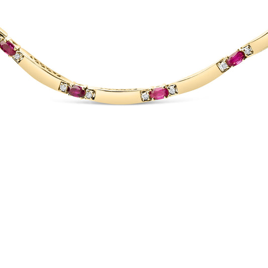 Close-up front view of a yellow and white metal necklace featuring oval-shaped red gemstones and round white gemstones in 4-prong settings.