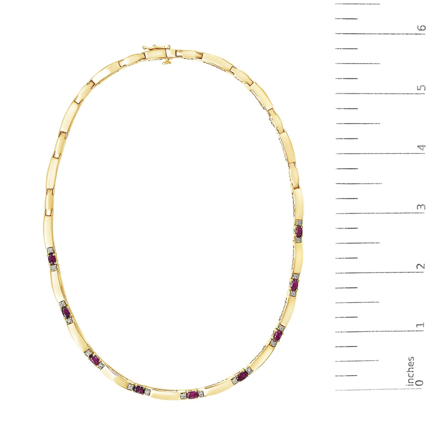 Yellow and white metal necklace with alternating red oval gemstones and white round gemstones in prong settings, shown flat on a white background next to a ruler for scale.