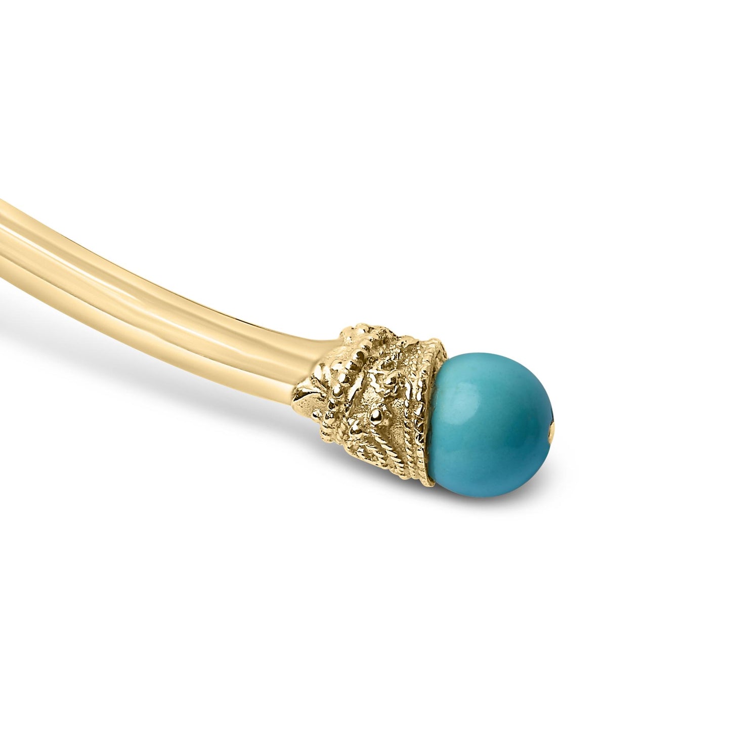 Close-up side angle of a yellow necklace end with intricate detailing holding a round blue gemstone.