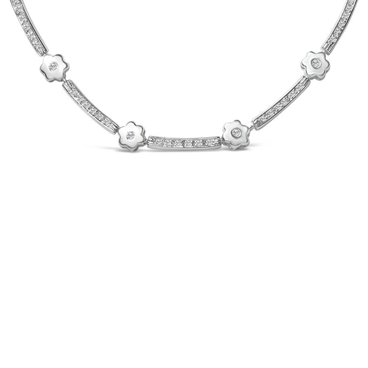Close-up front view of a white metal necklace featuring alternating flower-shaped elements and rectangular bars, each set with round white gemstones in bezel settings.