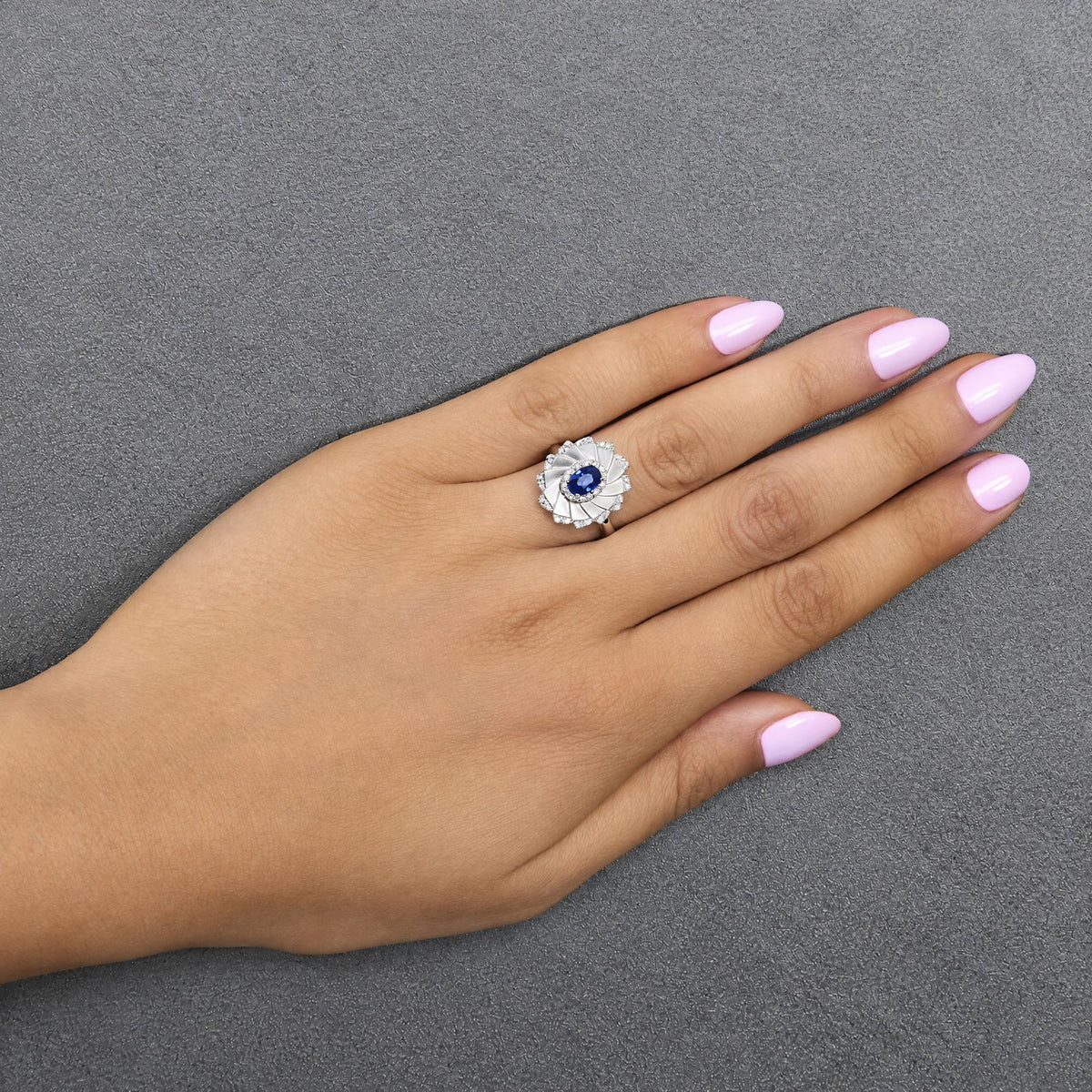 14K White Gold Oval Blue Sapphire and 1/5 Cttw Diamond Sunburst Halo Cocktail Ring