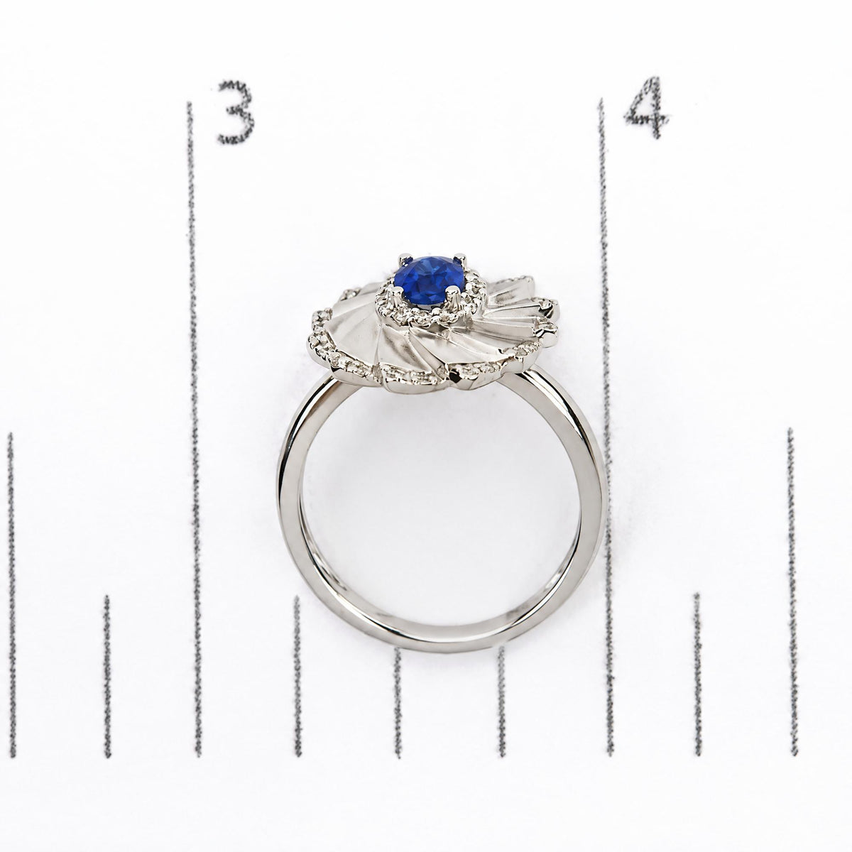 14K White Gold Oval Blue Sapphire and 1/5 Cttw Diamond Sunburst Halo Cocktail Ring