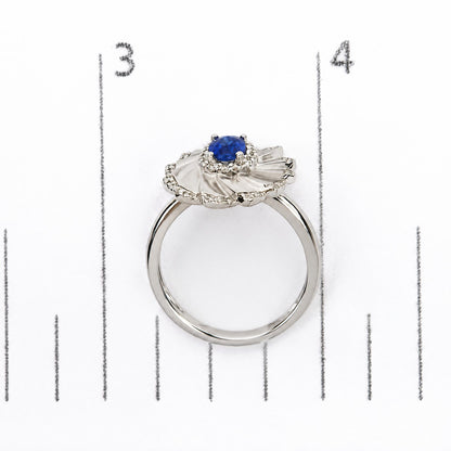 14K White Gold Oval Blue Sapphire and 1/5 Cttw Diamond Sunburst Halo Cocktail Ring