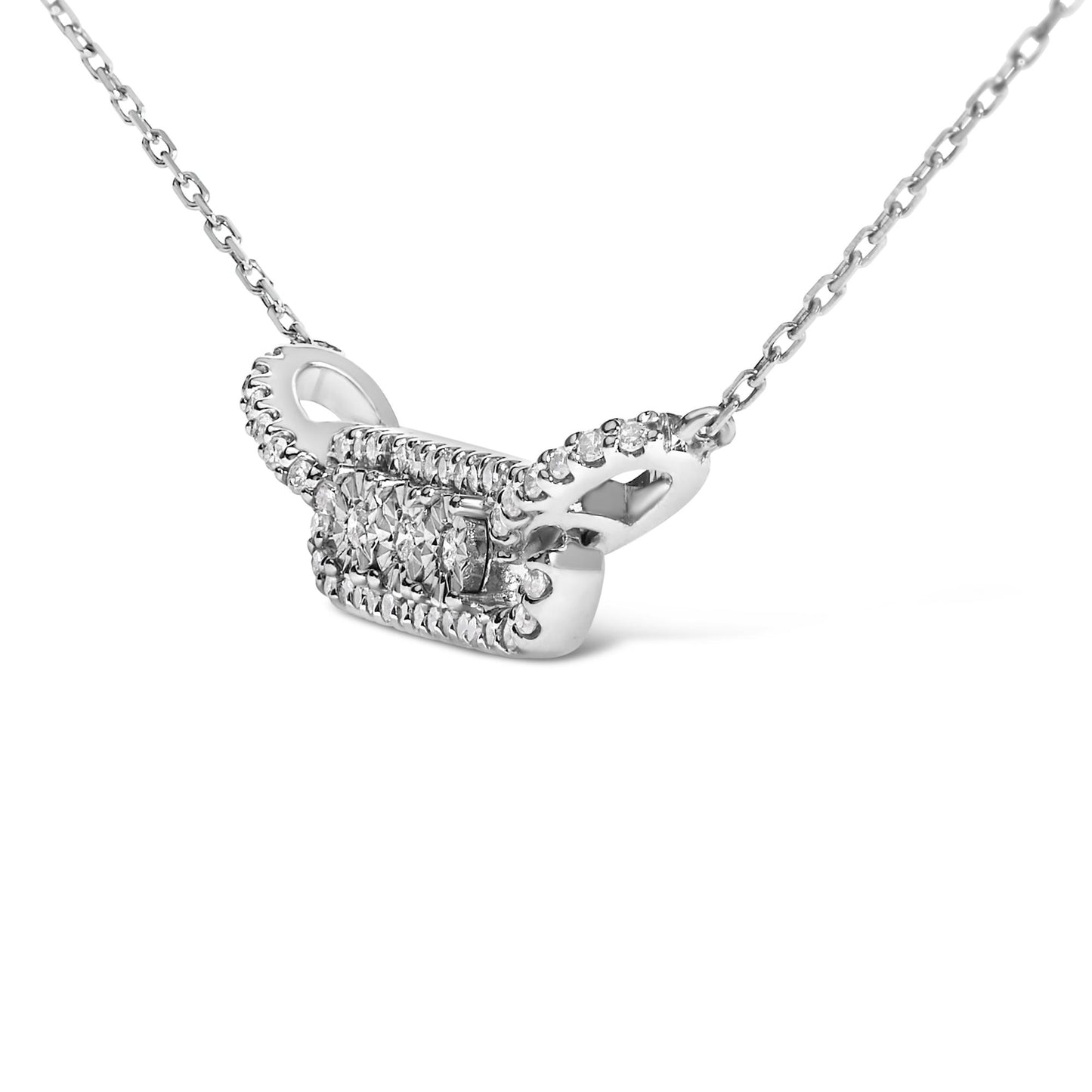 Close-up front angle of a white metal necklace with a rectangular pendant featuring three round white gemstones in the center surrounded by smaller round white gemstones along the edges, shown on a white background.