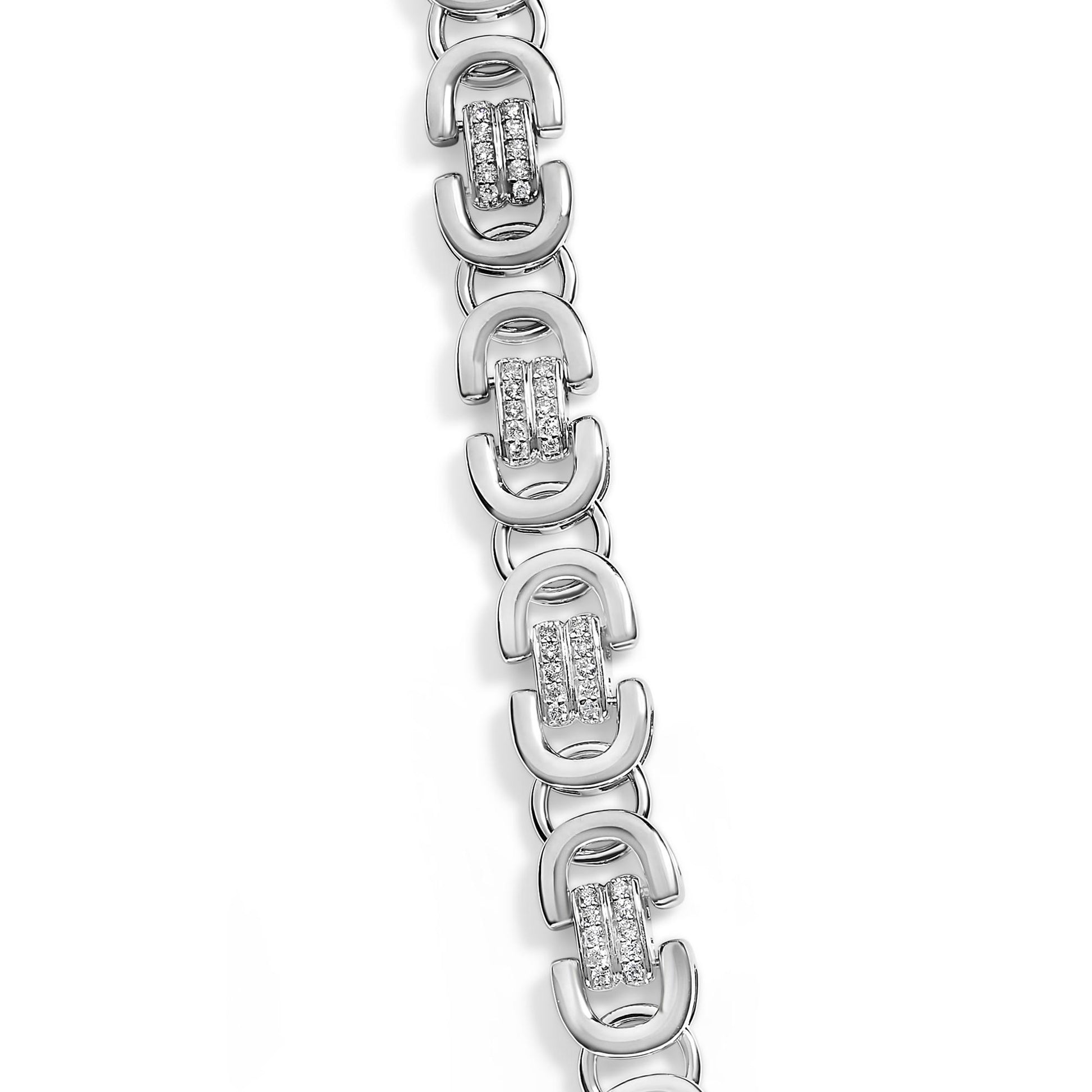 Close-up top-down view of a white metal necklace featuring alternating open D-shaped links and vertical bars studded with round white gemstones in prong settings.