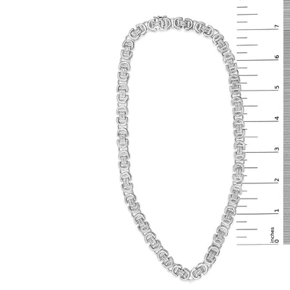 White necklace with linked oval-shaped sections, each containing multiple small round white gemstones in prong settings, shown flat on a white background with a ruler scale on the right side, top-down angle.