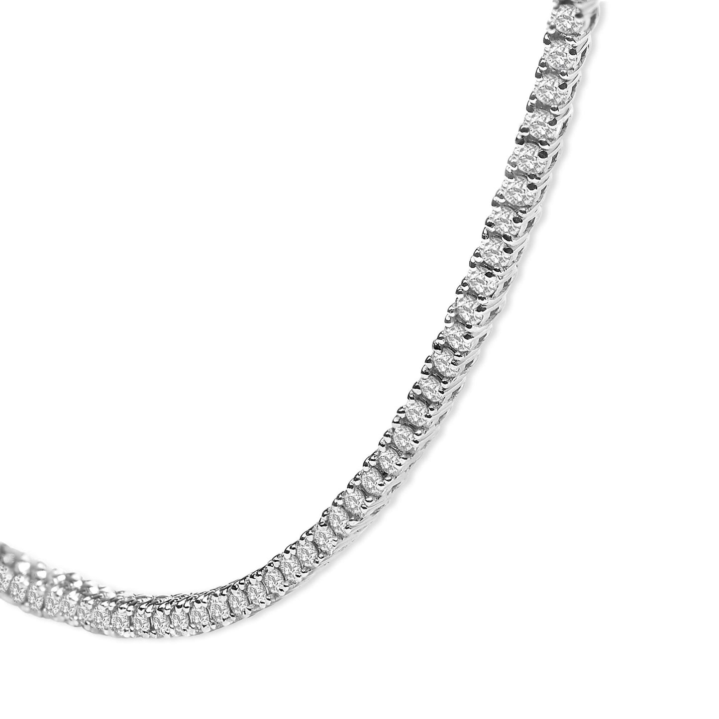 Close-up angled view of a white necklace featuring round white gemstones set in prong settings along its length.