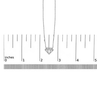 White necklace with a geometric diamond-shaped pendant set with round white gemstones, shown on a ruler scale, front view.