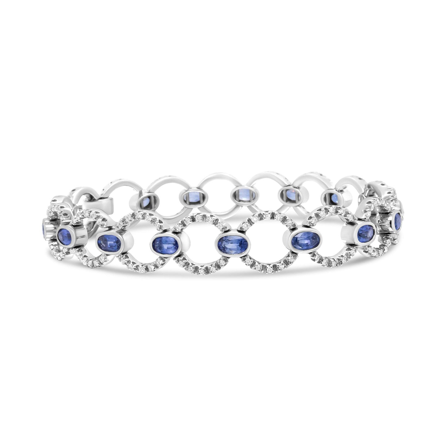 Front angle view of a white bracelet featuring linked circular sections with prong-set round white gemstones surrounding bezel-set oval blue gemstones.