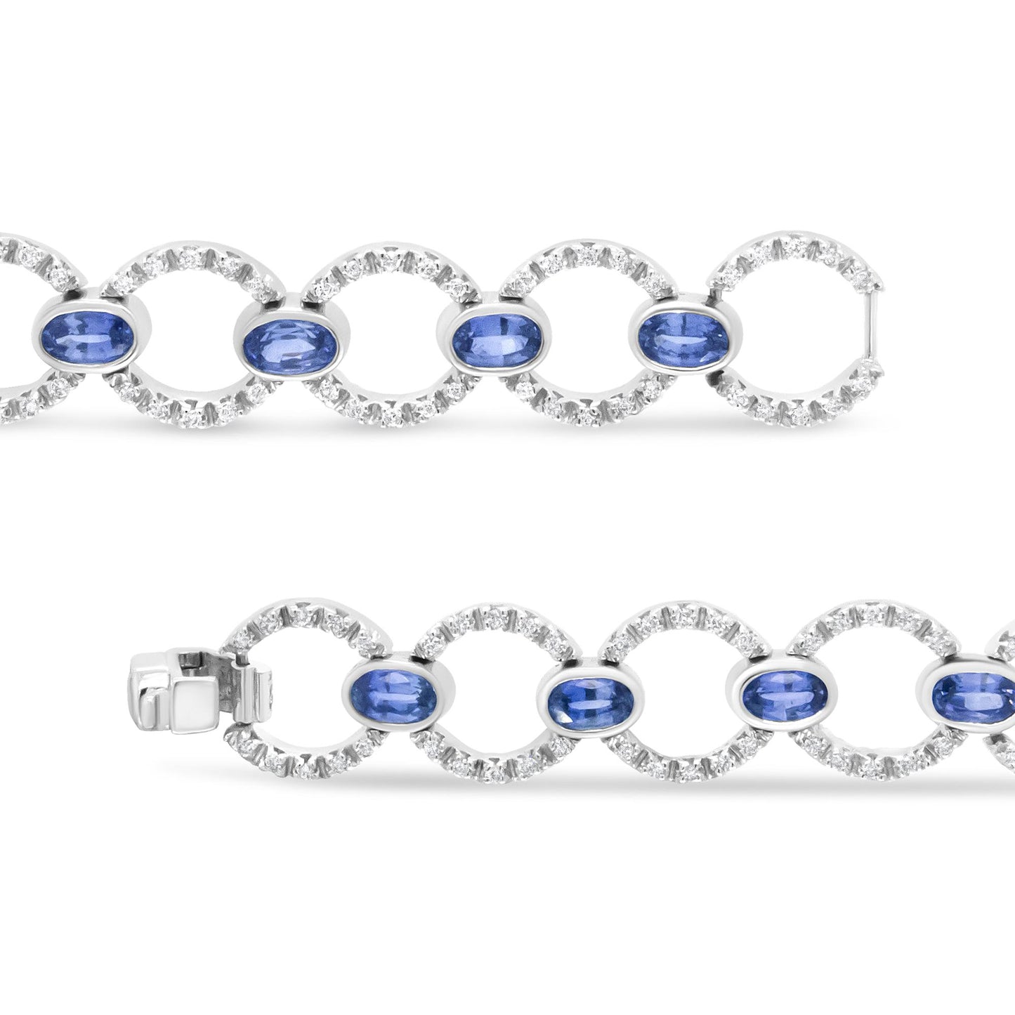 White metal bracelet with alternating oval blue gemstones in bezel settings and circular links encrusted with round white gemstones in prong settings, shown in a close-up horizontal top-down view.
