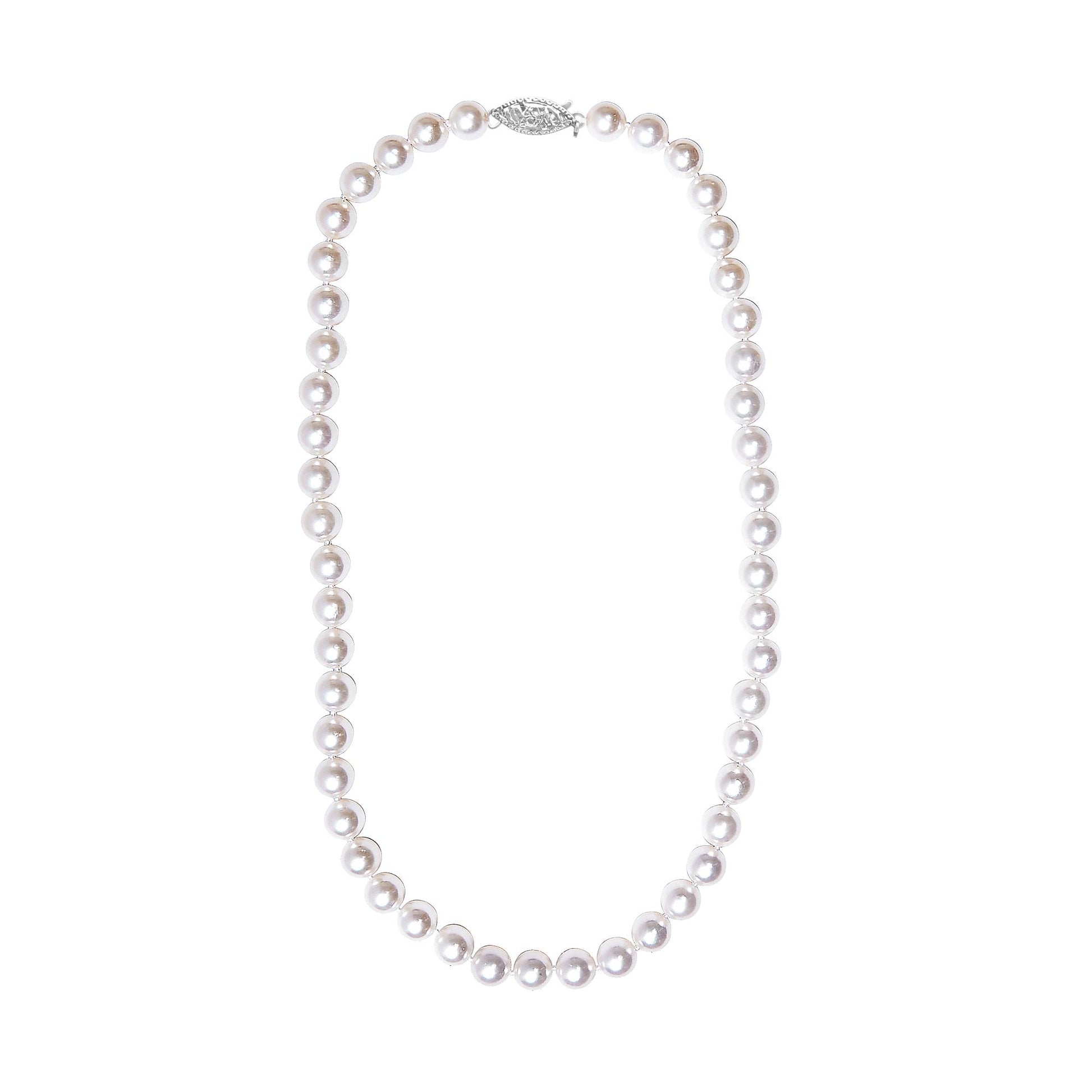 Top-down view of a white pearl bead necklace with a decorative clasp.