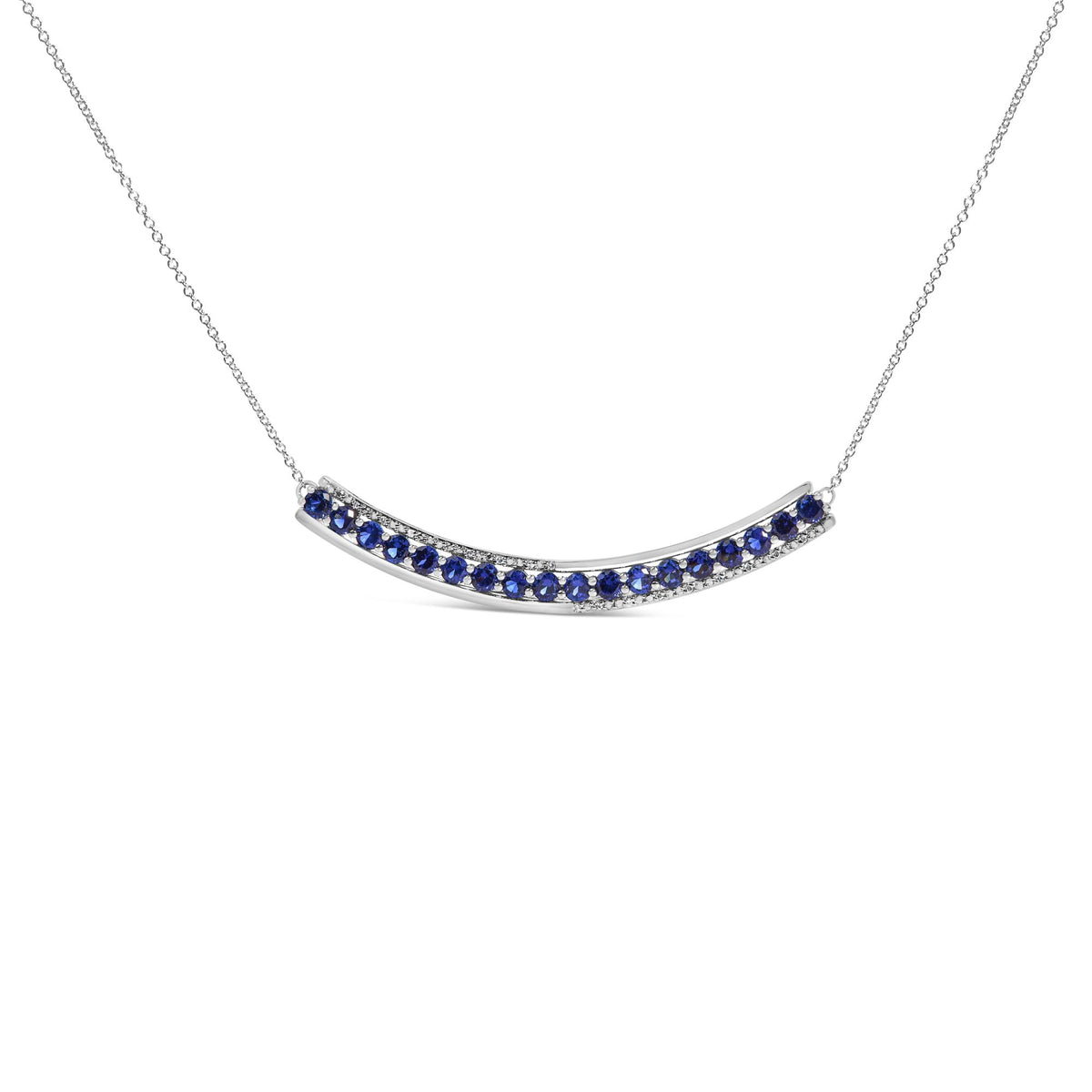 Close-up front view of a white necklace with a curved bar pendant featuring alternating round blue and white gemstones in prong settings.