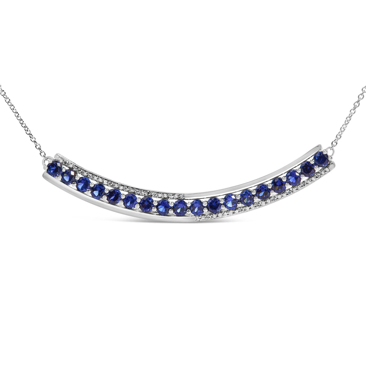 Close-up front angle of a white necklace featuring a curved bar with alternating blue gemstones and white gemstones in prong settings along the bar, shown on a white background.