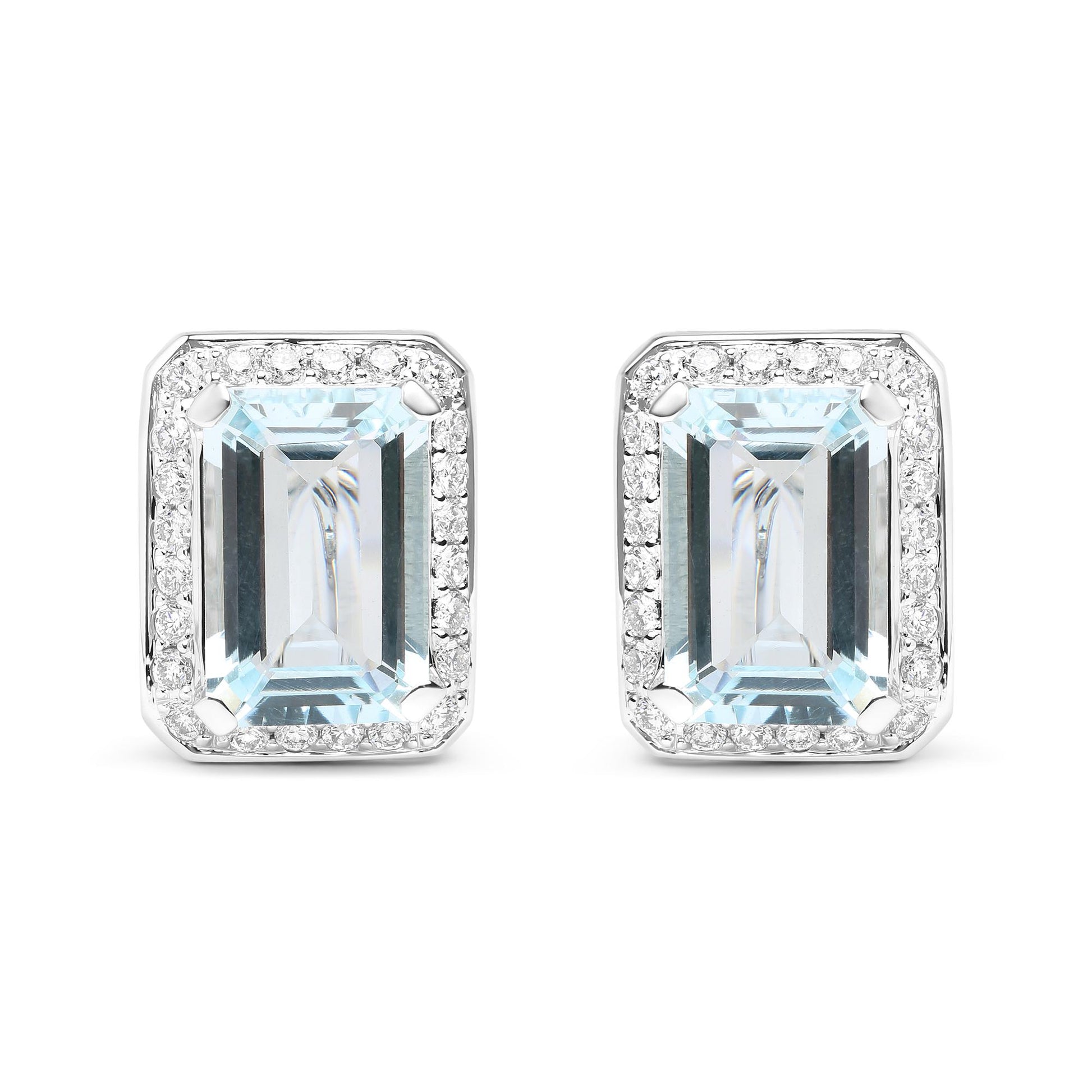 Front-facing shot of white metal earrings featuring large rectangular blue gemstones surrounded by a border of small round white gemstones.