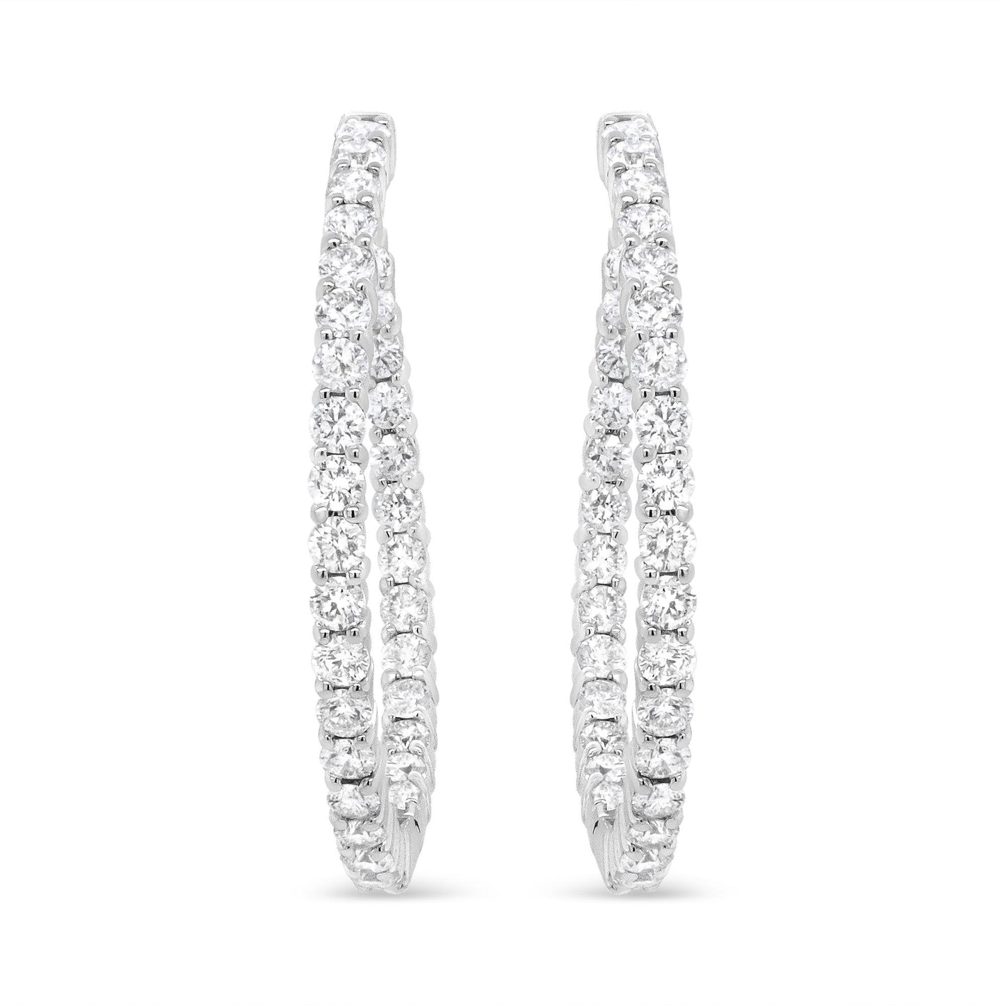 Pair of white metal hoop earrings with two rows of prong-set round white gemstones, shown from the front angle on a white background.